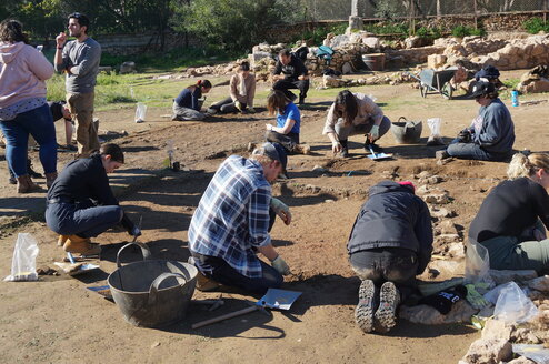 Students digging at excavation site