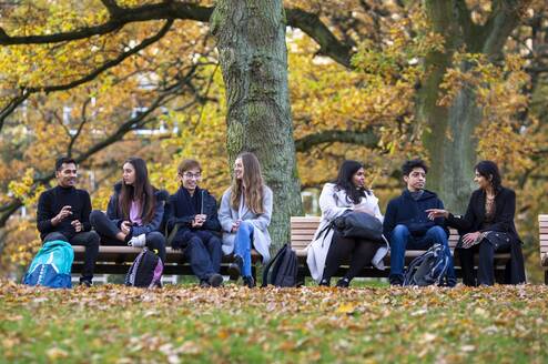 Students sitting on a bench