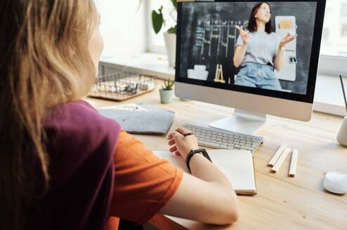 online ESL student watching online ESL teacher
