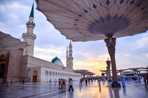 People walking outside a Mosque in Saudi Arabia