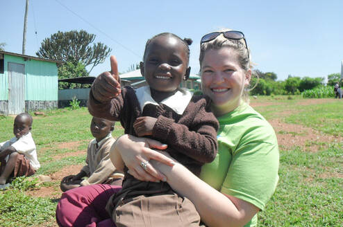 volunteer with a young girl