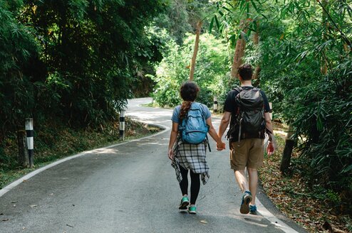 Couple walking together holding hands