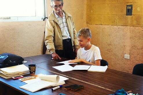Spanish teacher and student in class