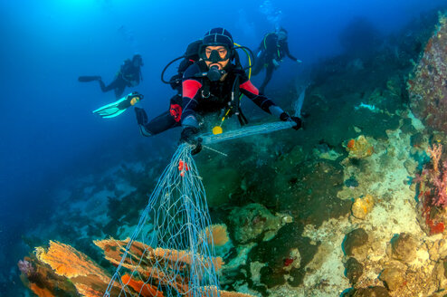 Scuba diver working on marine conservation in Krabi Thailand