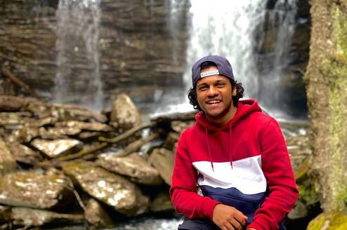 Spirit intern in front of a waterfall