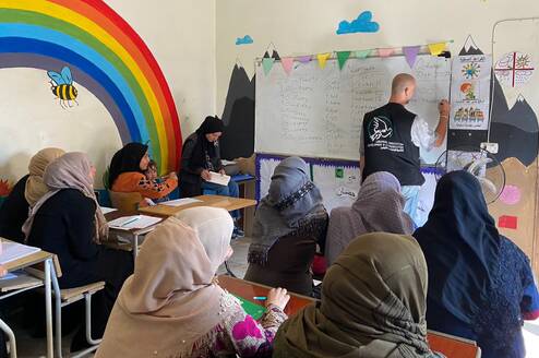 Teacher teaching students ESL