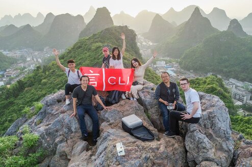 young people after a hike on top of a mountain in guilin