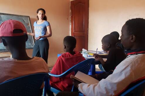 Teaching English to street boys.