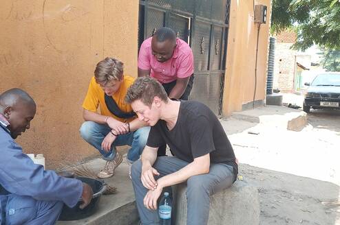 Volunteers were learning how to make briquettes using char