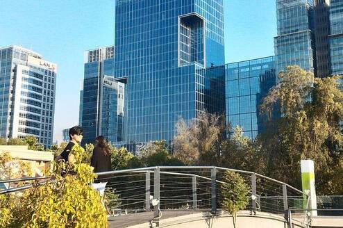 Buildings with trees sorrounding them.