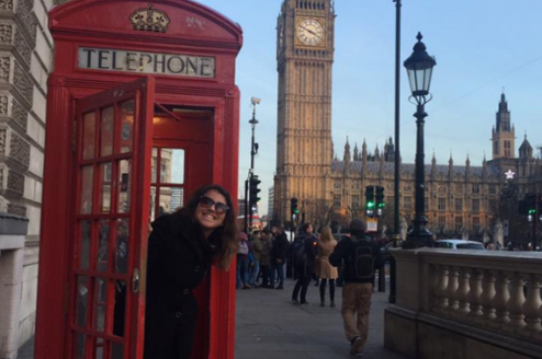 Intern in phonebooth in front of Big Ben 