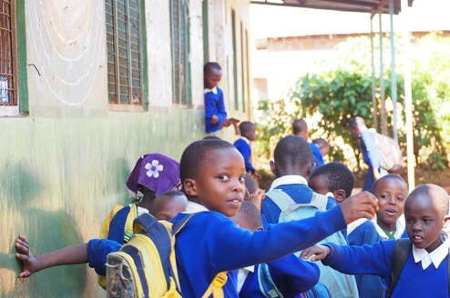 Students at Mrupanga Primary entering the class ready for a mental health club session with FEF