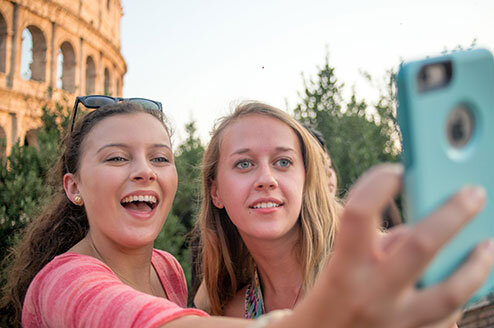 Students by the Colosseum of Rome, Italy.