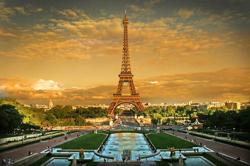 The Eiffel Tower glows in sunlight in front of the Trocadero