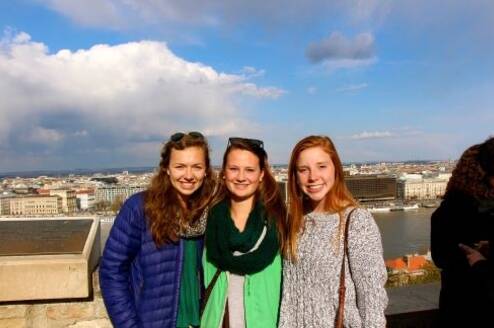 Students standing in front of the Seville skyline