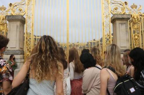 High school students in front of the gates of Versailles