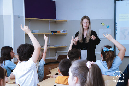 Meddeas Language Assistant with her students