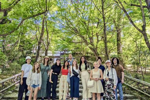 group smiling in the trees