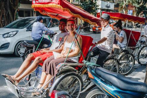 Students riding tuk tuk