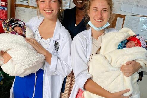 Volunteer providing hands-on medical assistance in a Tanzanian clinic