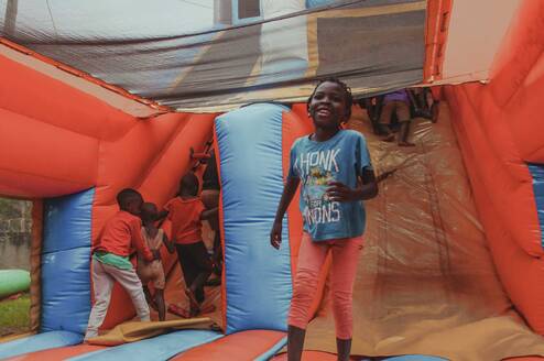 Young children jumping on a bouncing castle