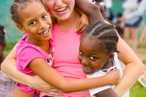VISIONS Dominican Republic local kids with participant