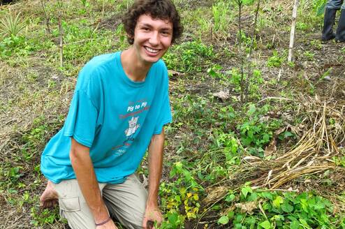 Reforestation Intern Planting Trees