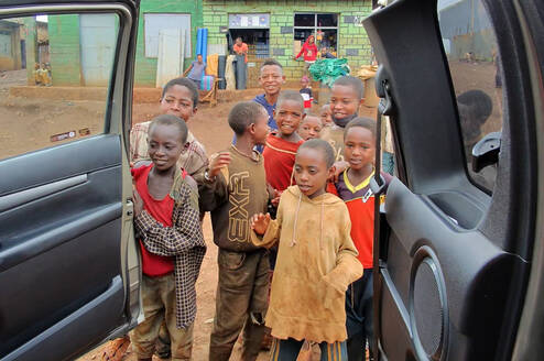 the children are welcoming  their teacher 