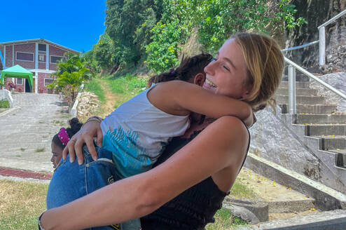 blonde woman hugging child