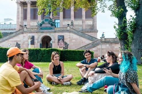 EF language year abroad students hanging out together in a central city park