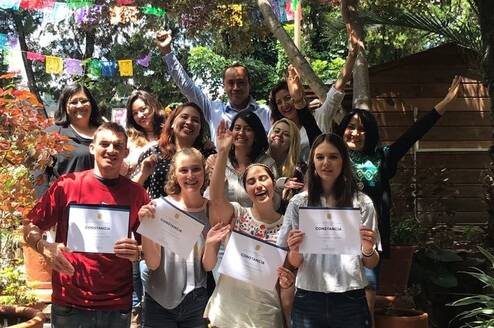 A group of teachers celebrating qualification 