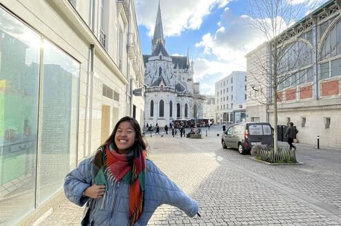 A student smiling in the streets of Nice.
