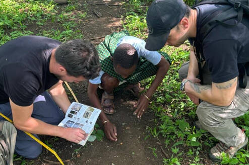 Volunteers comparing footprints 