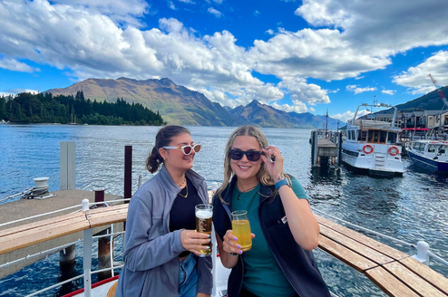 Two girls smiling on a boat in Queenstown