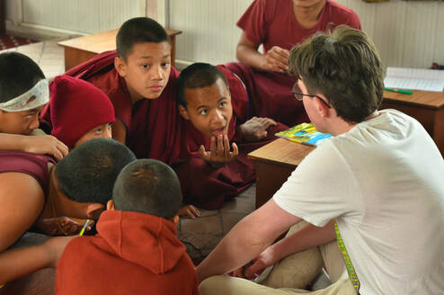 Tim from Germany teaching monks in monastary 