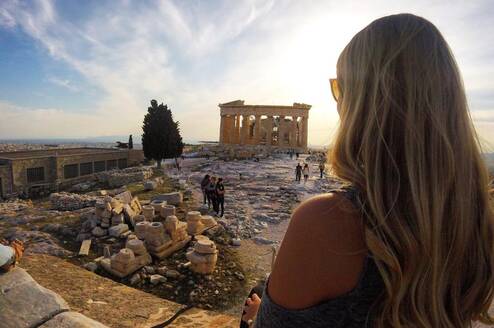 Girl looking out over Athenian ruins