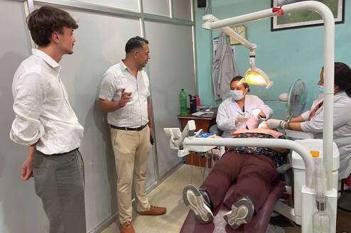 Nepal Dental Interns performing a checkup on a patient