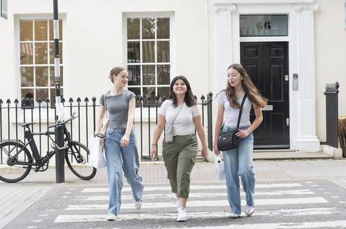 Students walking across the street in London