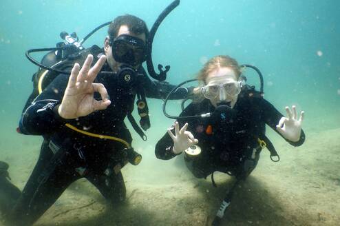 Volunteers scuba diving together during a marine conservation program in southern Tanzania