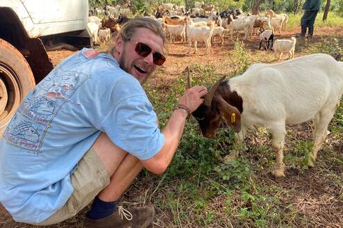 Volunteer with a goat