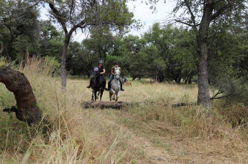 Volunteers on the cross country course jumping together