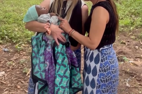 women holding child