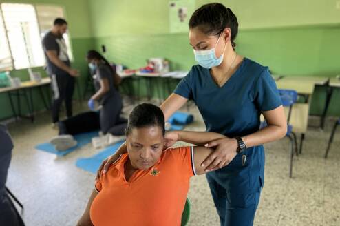 Nurse helping a Dominican Citizen