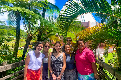 Students pose in front of a Bahai Temple