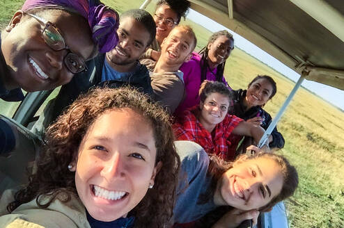 Group photo in safari vehicle.