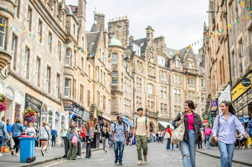 Students exploring Cockburn Street in Edinburgh's old town