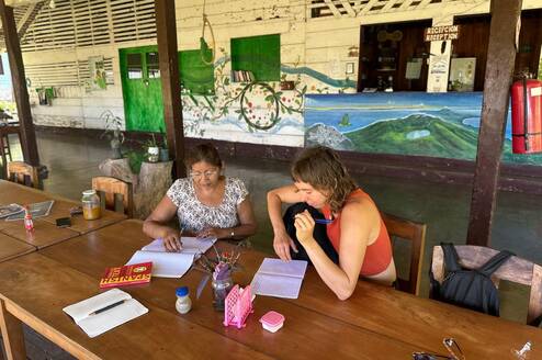 A women studying with local teacher