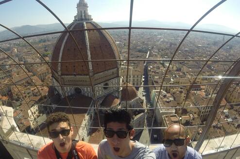 Three students look out over the Duomo in Florence, Italy.