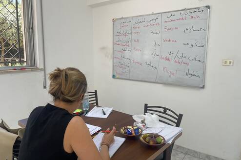 International student taking one-on-one Arabic lessons in a classroom at Shami Arabic Institute