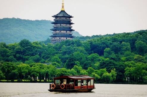 Hangzhou west lake and boat on the water 